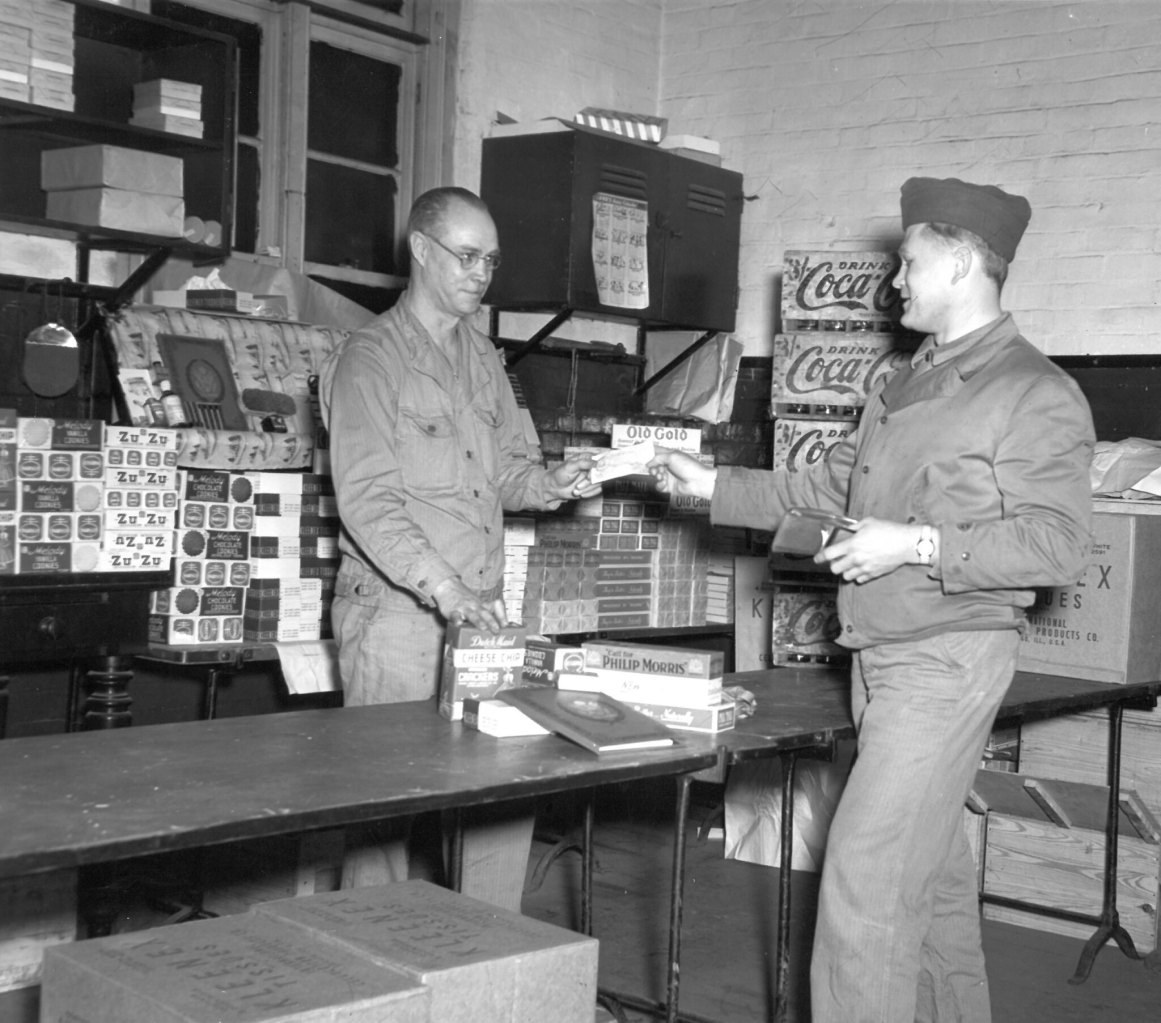 Exchange associate assisting Soldier.