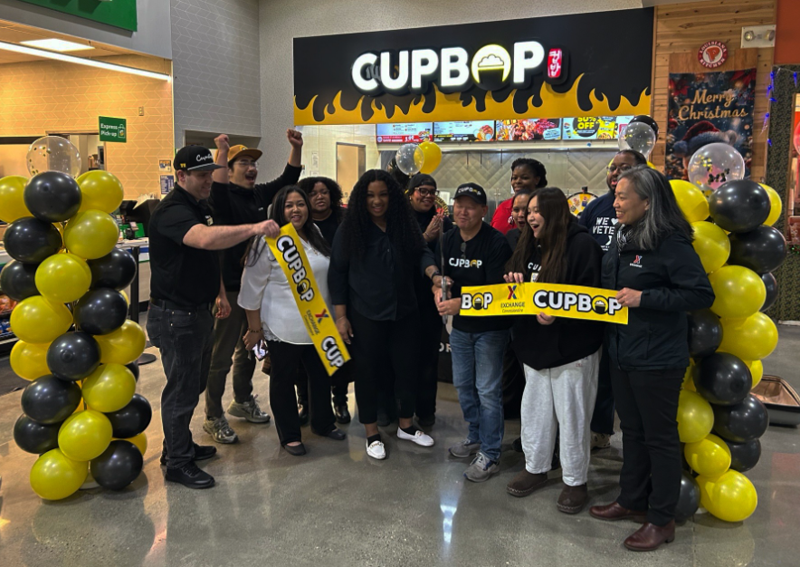 Large group of people at ribbon-cutting