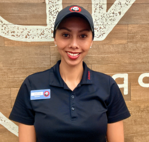 Suchanan Johnson photo. She is wearing a Panda Express polo, cap and badge.