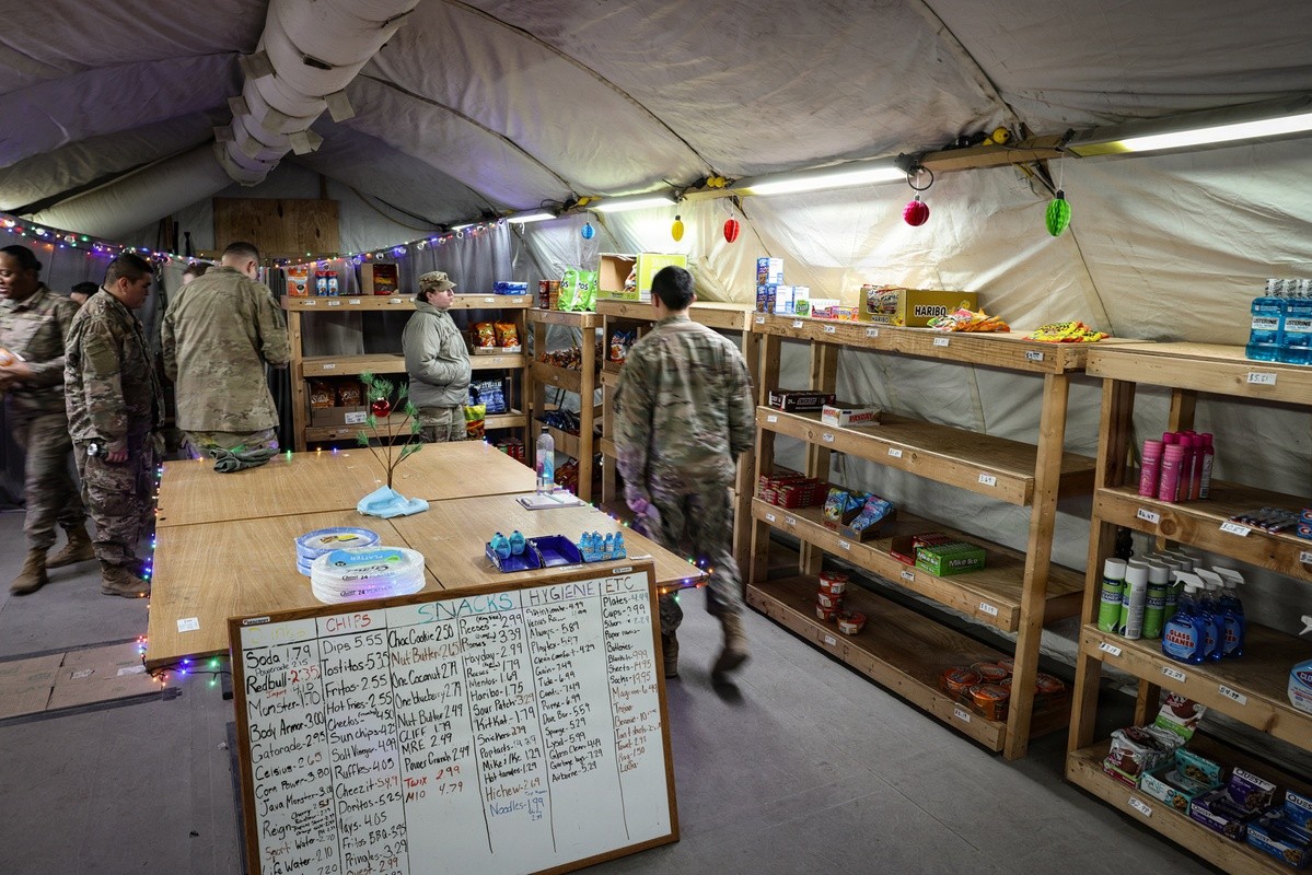 Soldiers shopping inside Exchange tent.