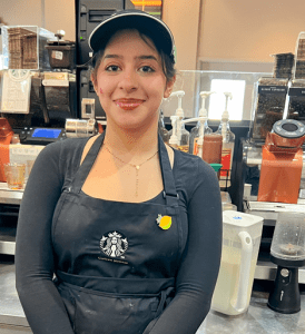 Heather Figueroa photo. She is wearing a Starbucks cap and apron.