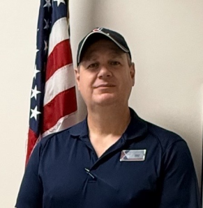 Jared Martin head shot with U.S. flag in background