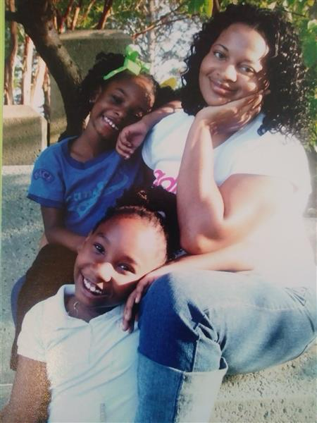 Teonja Tatum and her sister as little girls, with their aunt.