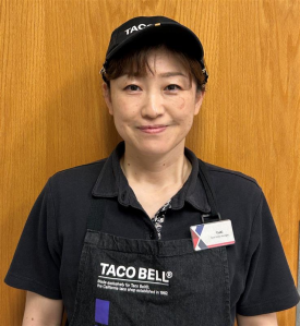 Yuki Ikeda head shot. She is wearing a Taco Bell hat and polo shirt.