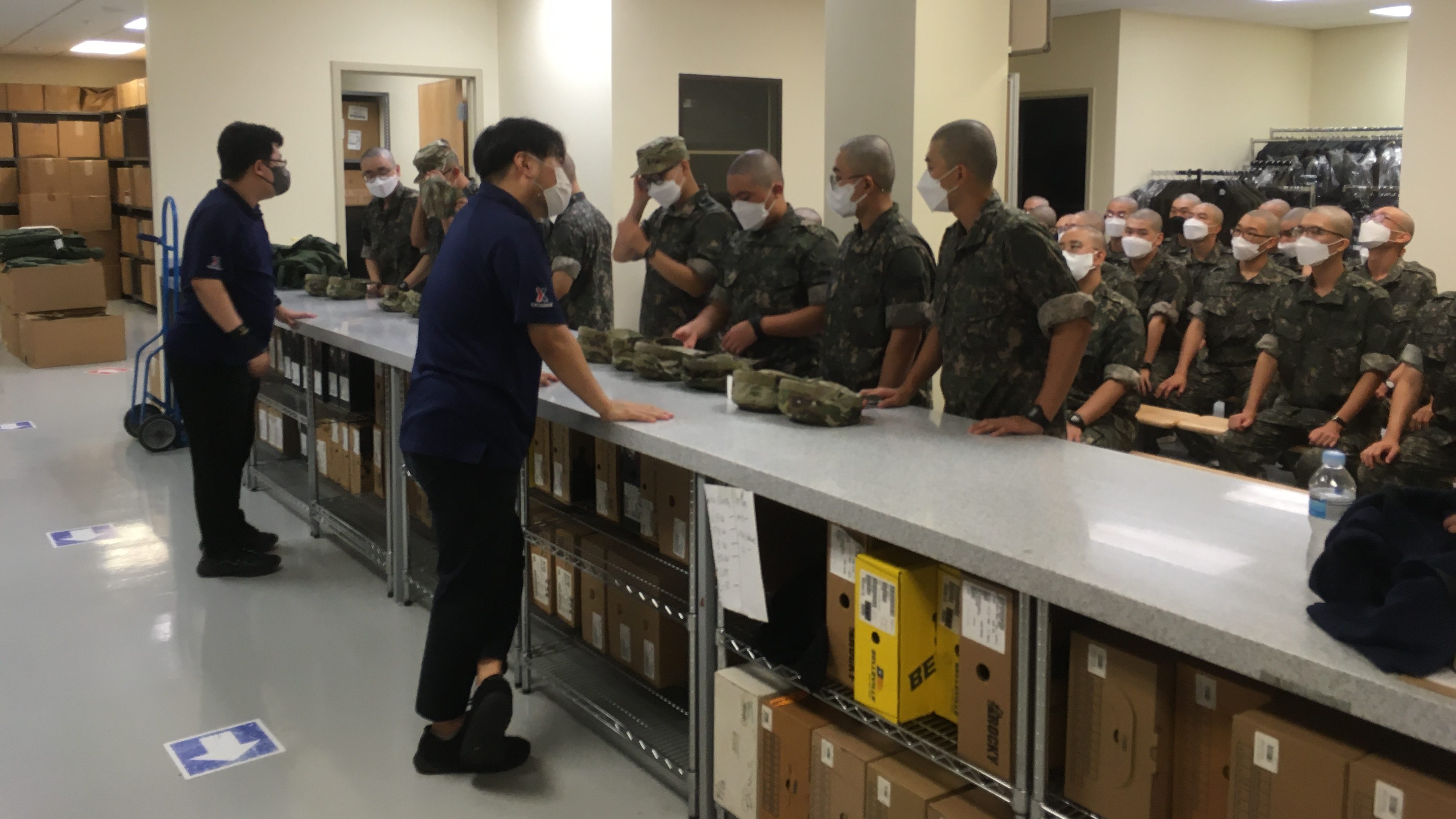 Two Exchange associates assist at large group of Republic of Korea Soldiers at USAG Humphreys in South Korea.
