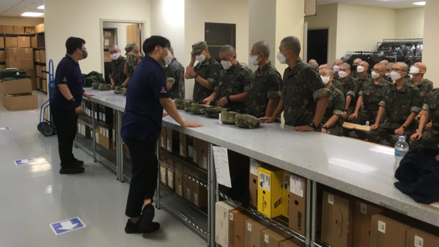 Two Exchange associates assist at large group of Republic of Korea Soldiers at USAG Humphreys in South Korea.