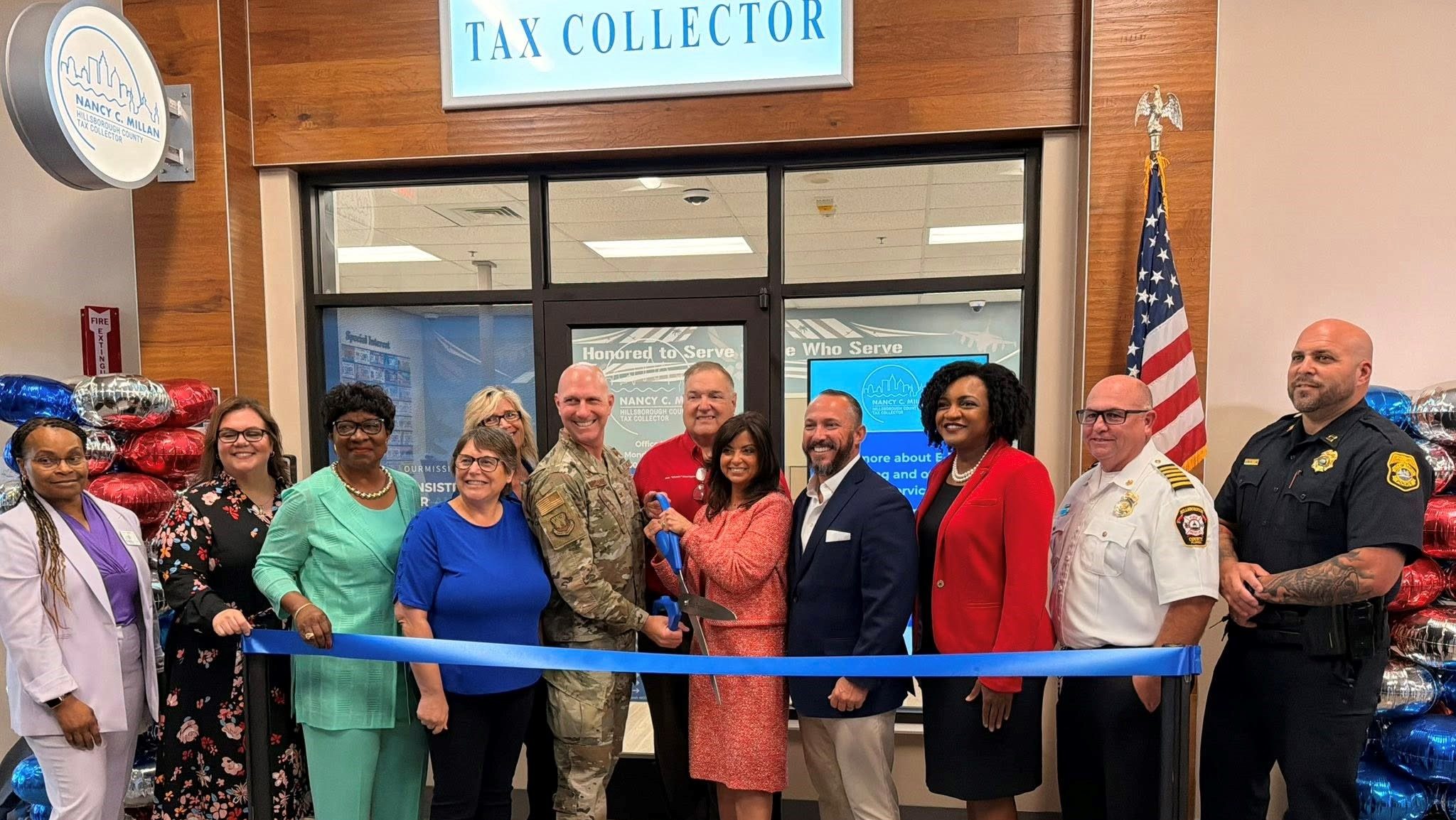 Seen, from left, are: Bernice Richardson, director of branch operations; Jennifer Castro, chief deputy tax collector; Gwen Myers, commissioner; Sherri Samudio, MacDill Exchange services business manager; Joanne Scott, store manager; Col. Edward Szczepanik, 6th Air Refueling Wing commander; Bob Henriquez, property appraiser; Nancy Millan, tax collector; Danny Alvarez, Florida House representative; Fentrice Driskell, Florida House representative; Jason Dougherty, Hillsborough County fire rescue chief; and David Michelson, Tampa Police captain