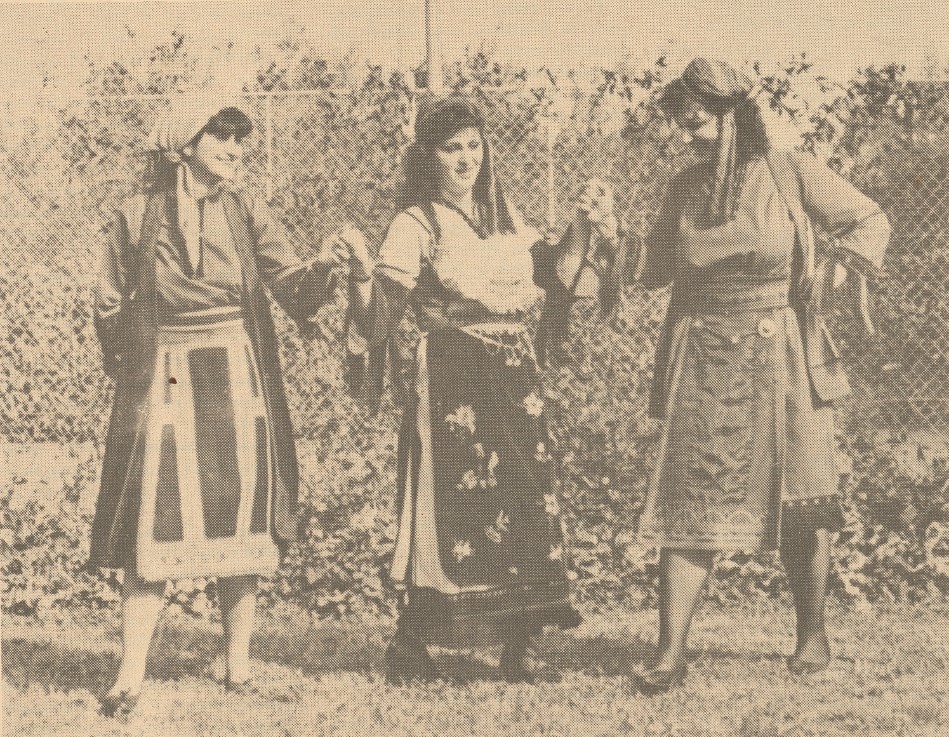 Three women in Greek folk dancer outfits.