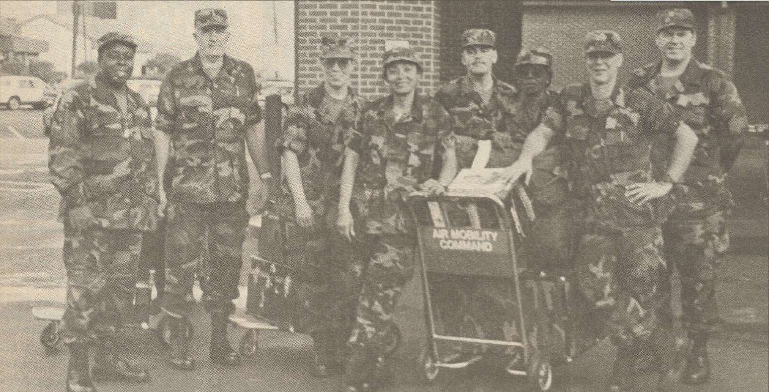 Eight members of the 'Haiti 9," in Army uniforms.