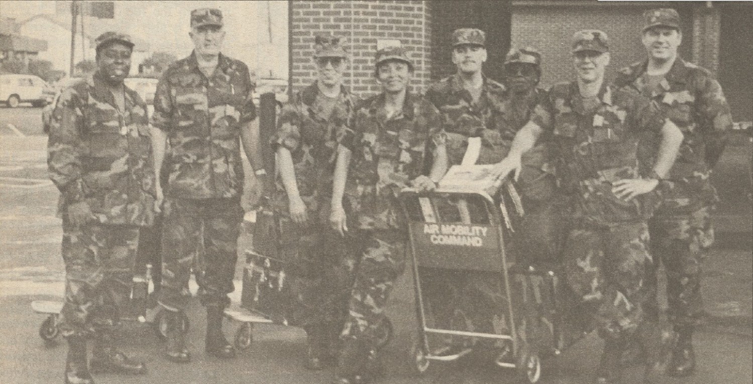 Eight members of the 'Haiti 9," in Army uniforms.