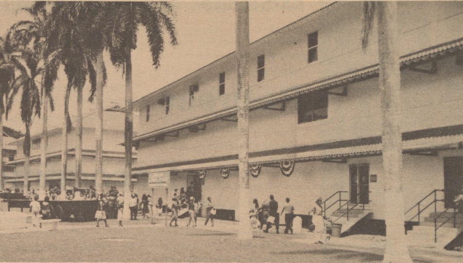 Archival photo of mall exterior with palm trees.