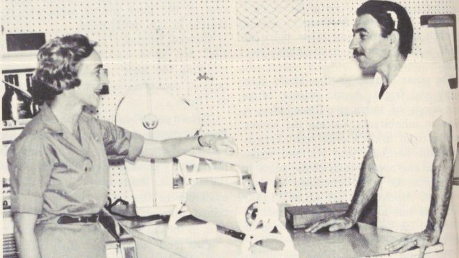 Archival photo of butcher serving customer at Brazil Exchange.