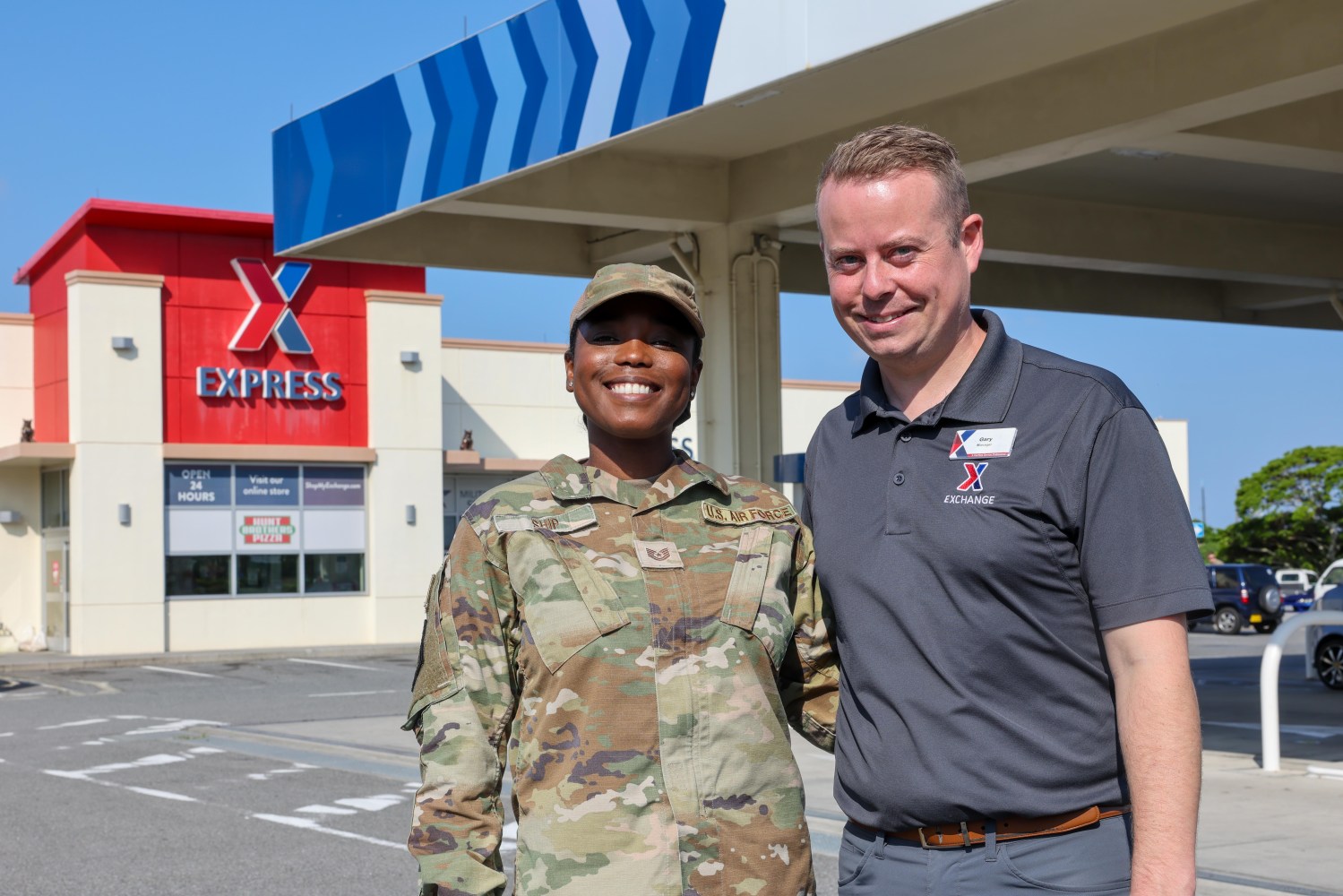 Gary Ship and his wife Shanice. She is an Air Force technical sergeant in uniform. He is wearing an Exchange polo shirt.