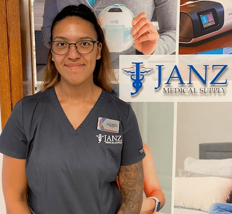 Jackel Sanchez head shot. She is standing by a Janz Medical Supply sign.